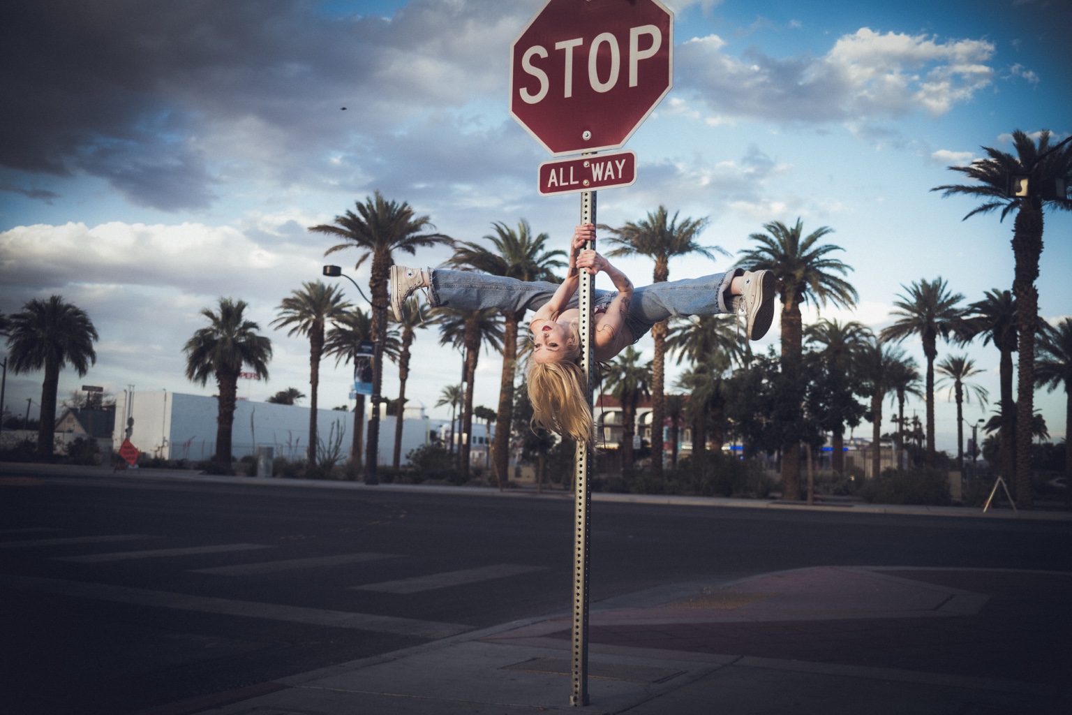 Performer inverted on a stop sign